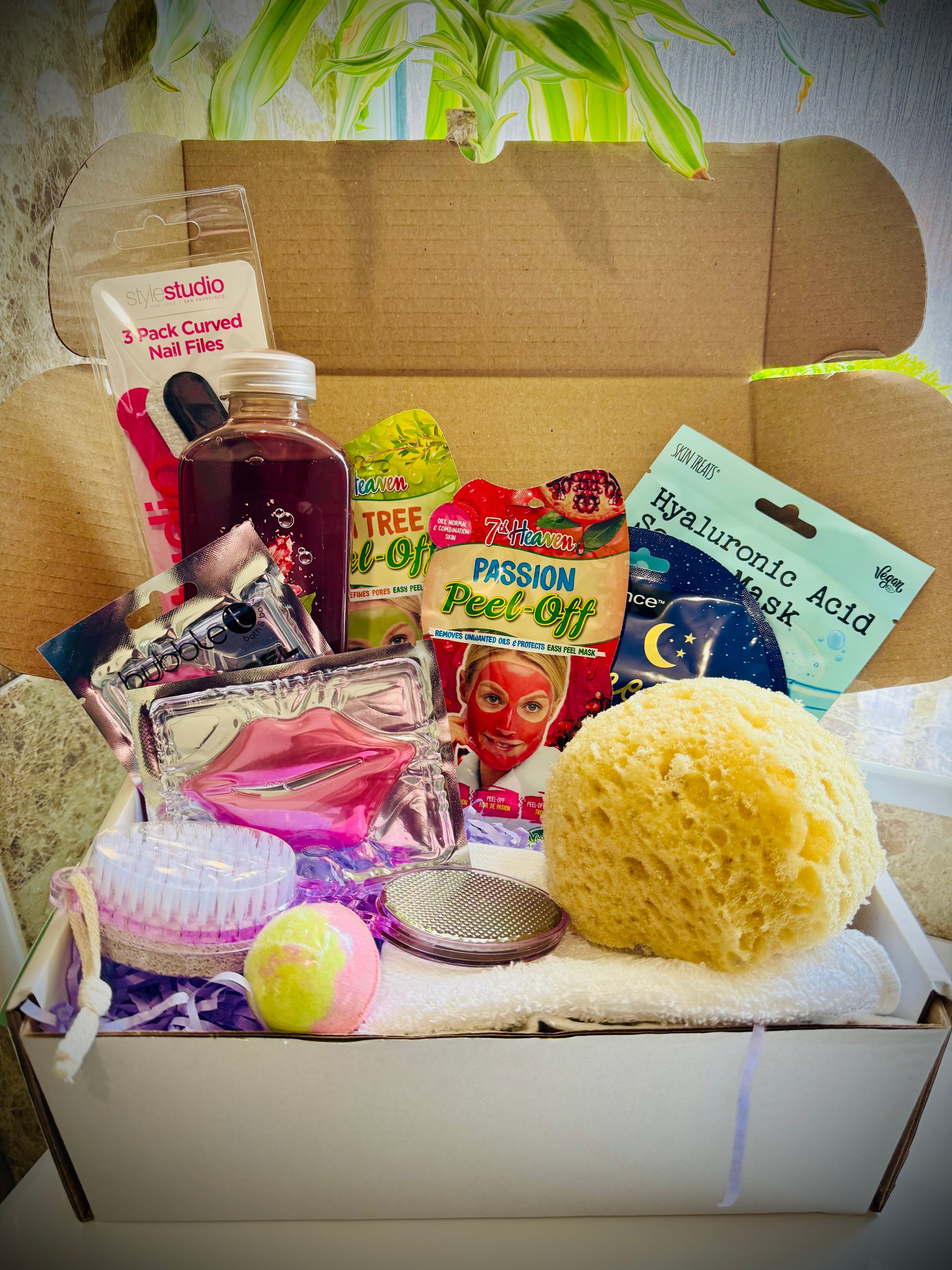 bath and shower gift set with skin care products and beauty tools in a gift box with a handwritten card £20