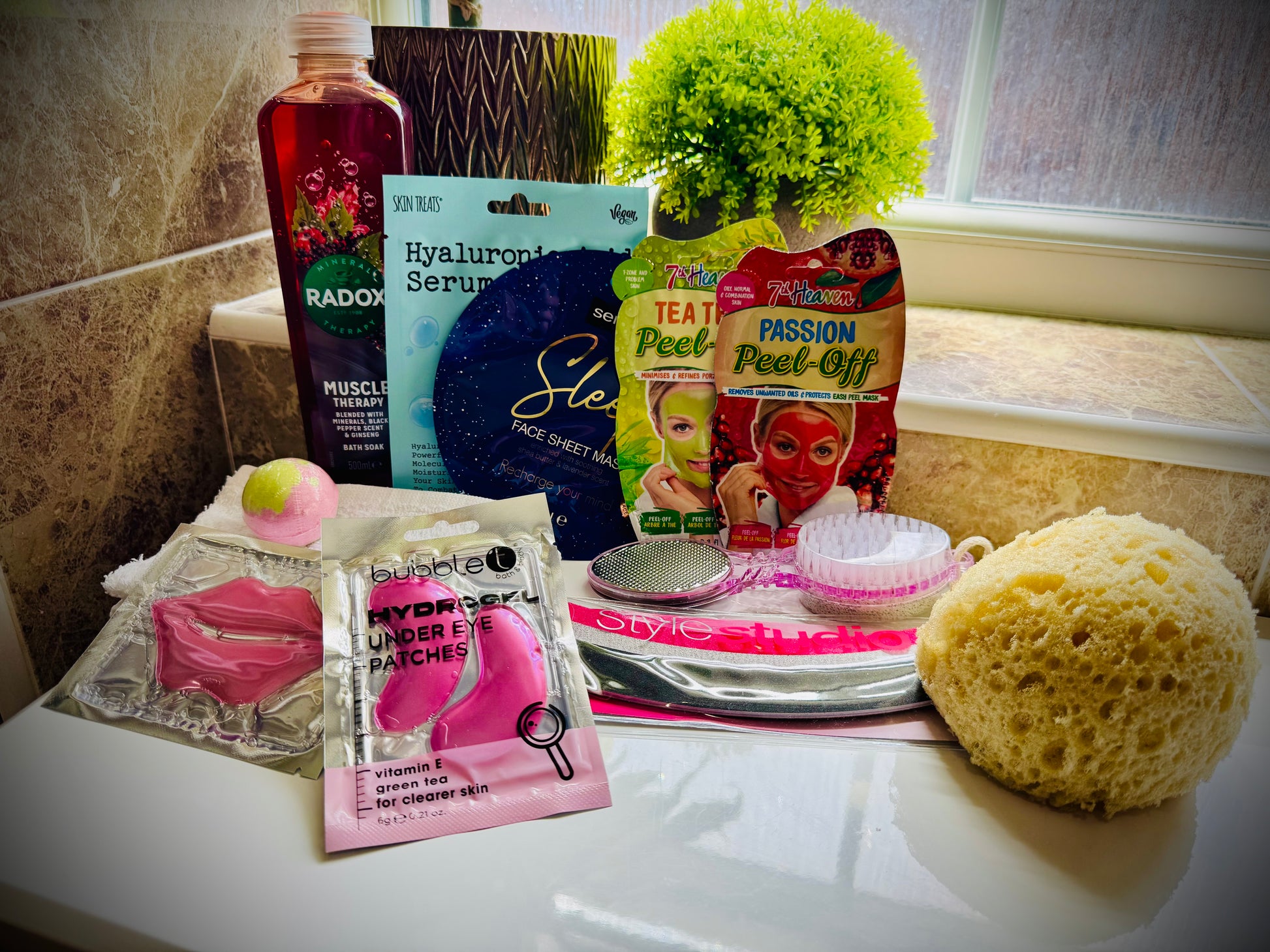 bath and shower gift set with skin care products and beauty tools in a gift box with a handwritten card £20