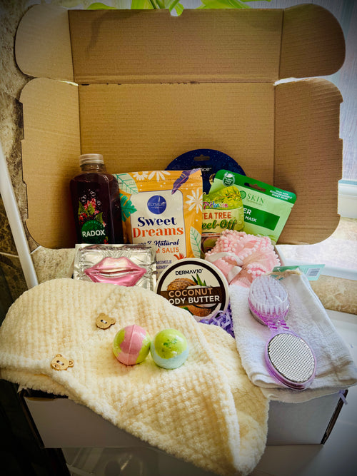 bath and shower gift set with skin care products and beauty tools in a gift box with a handwritten card £30