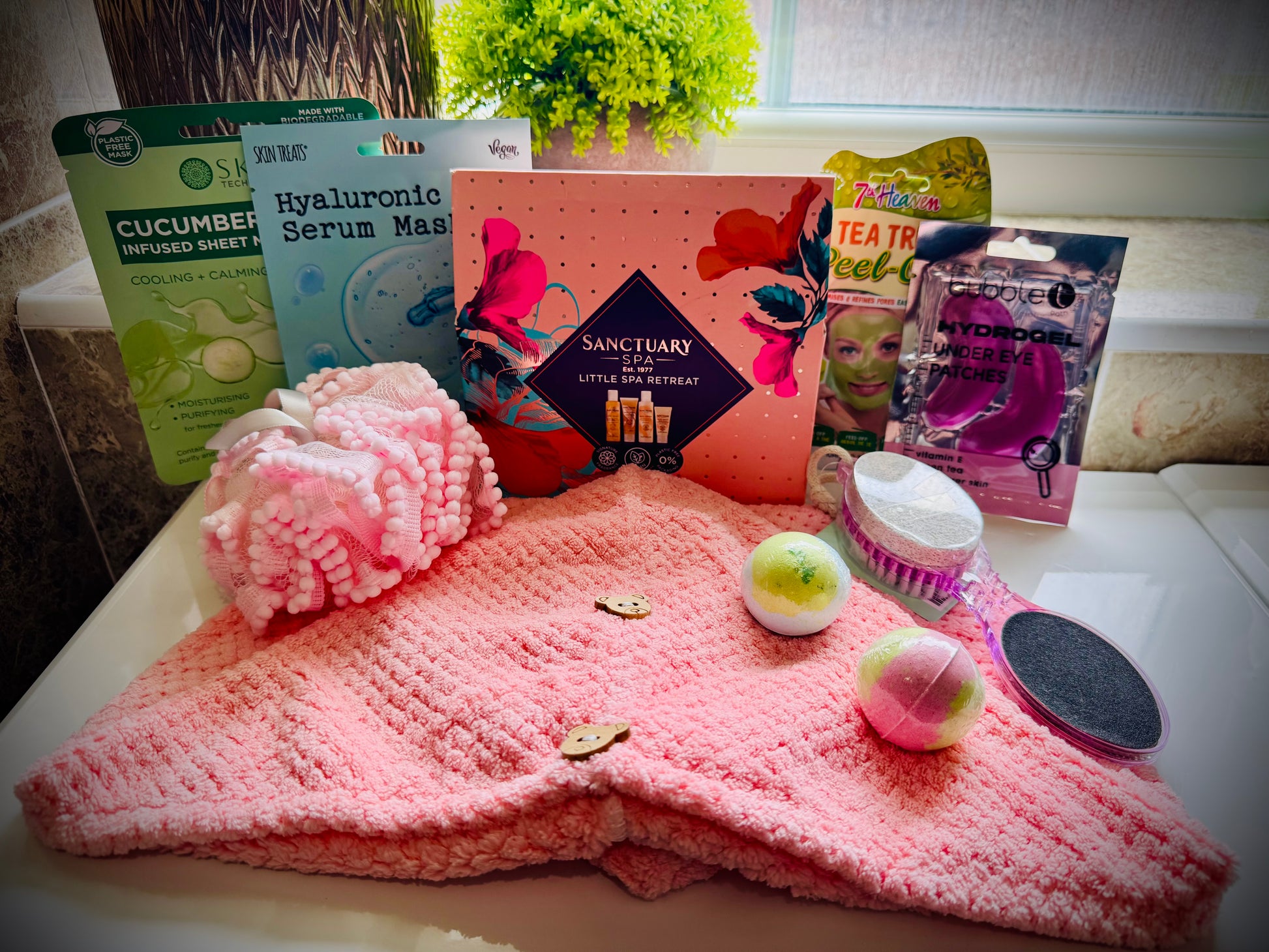 bath and shower gift set with skin care products and beauty tools in a gift box with a handwritten card £50