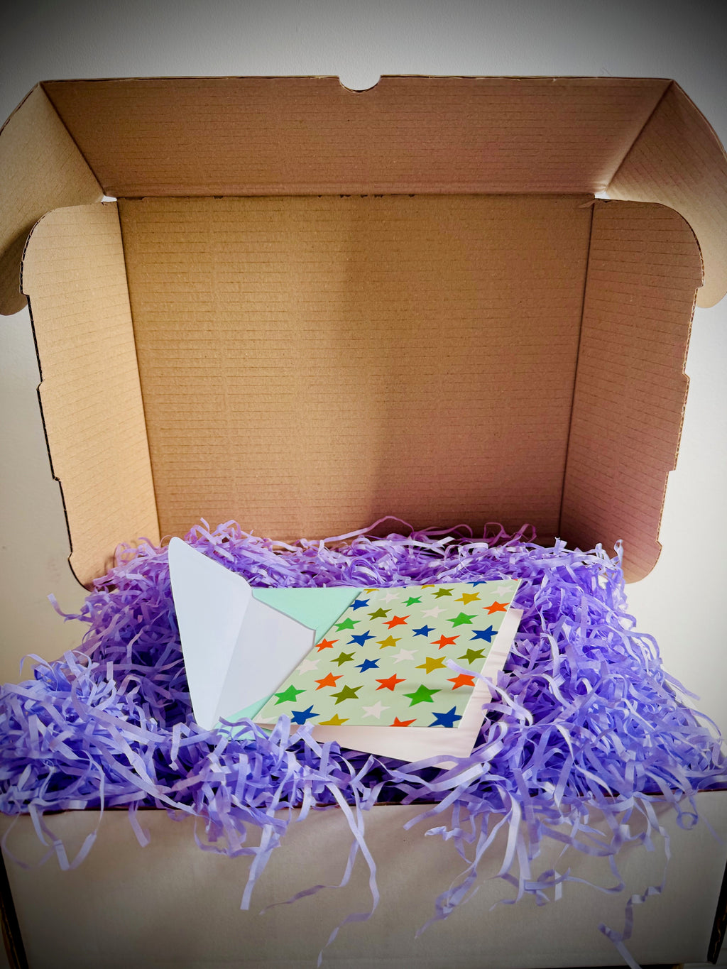 Colourful gift box packaging and handwritten card