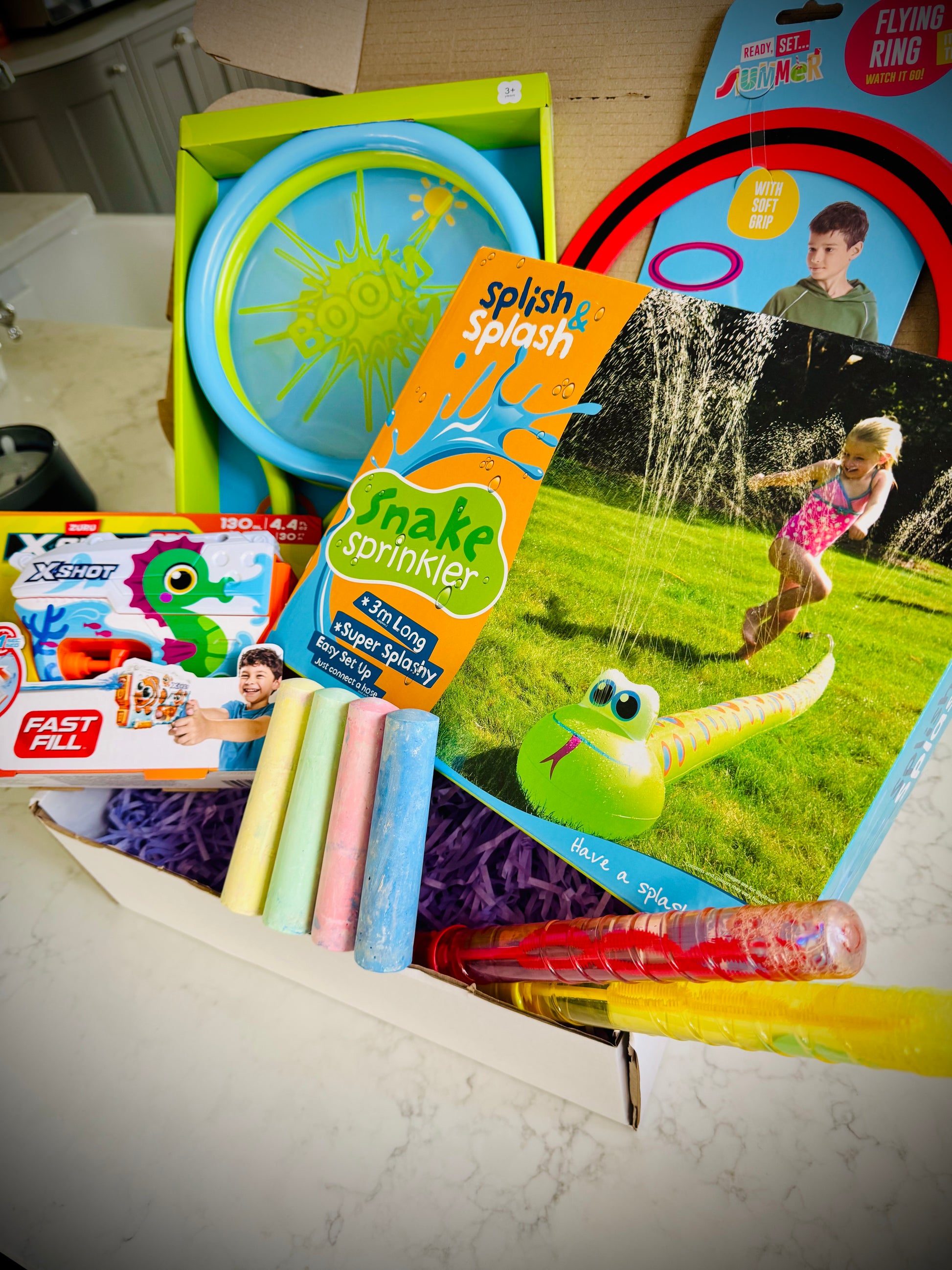 Kids outdoor toys in a birthday gift box with a handwritten card £30