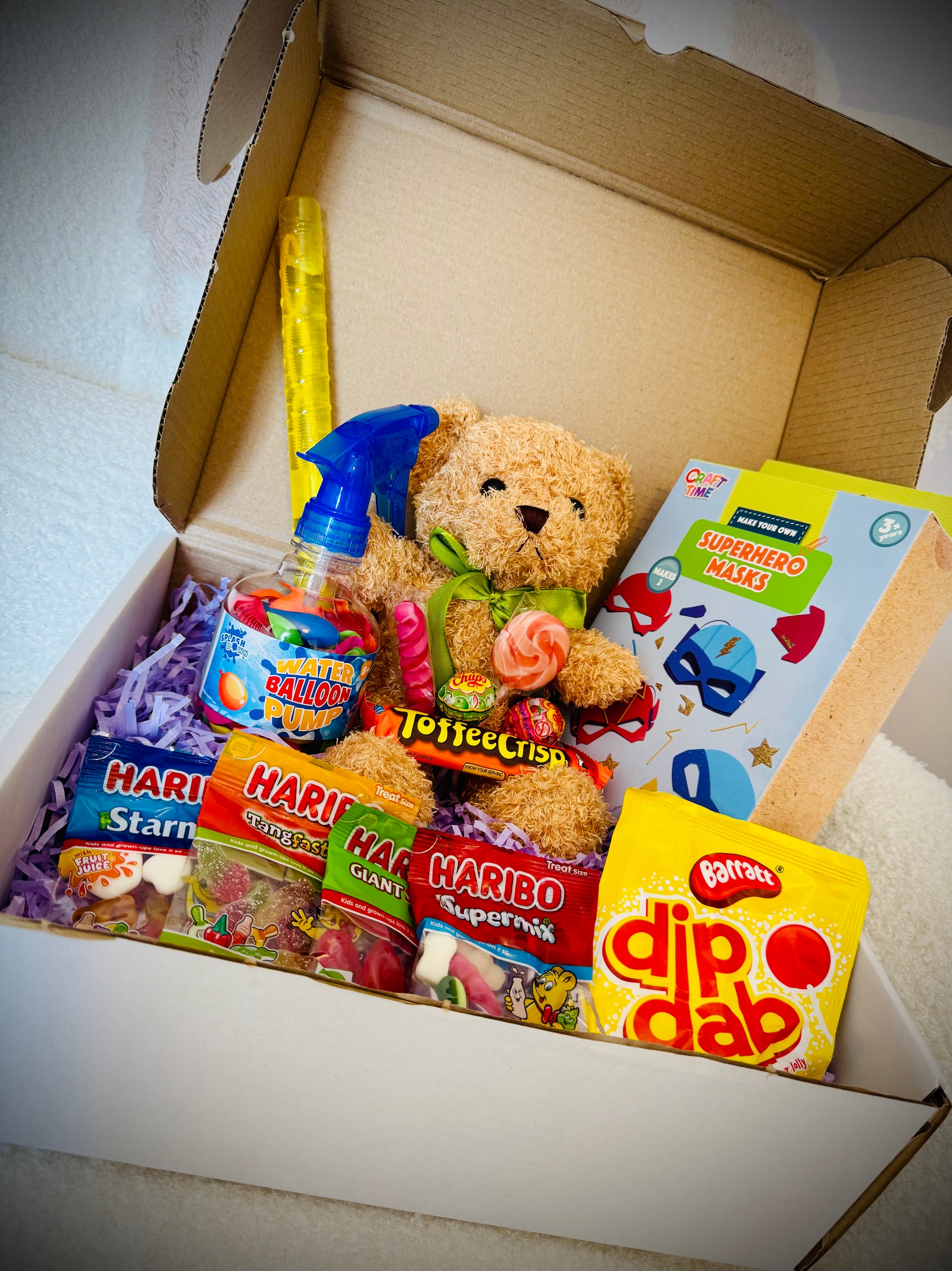 Mixed kids birthday gift box with toys art supplies and chocolates £20