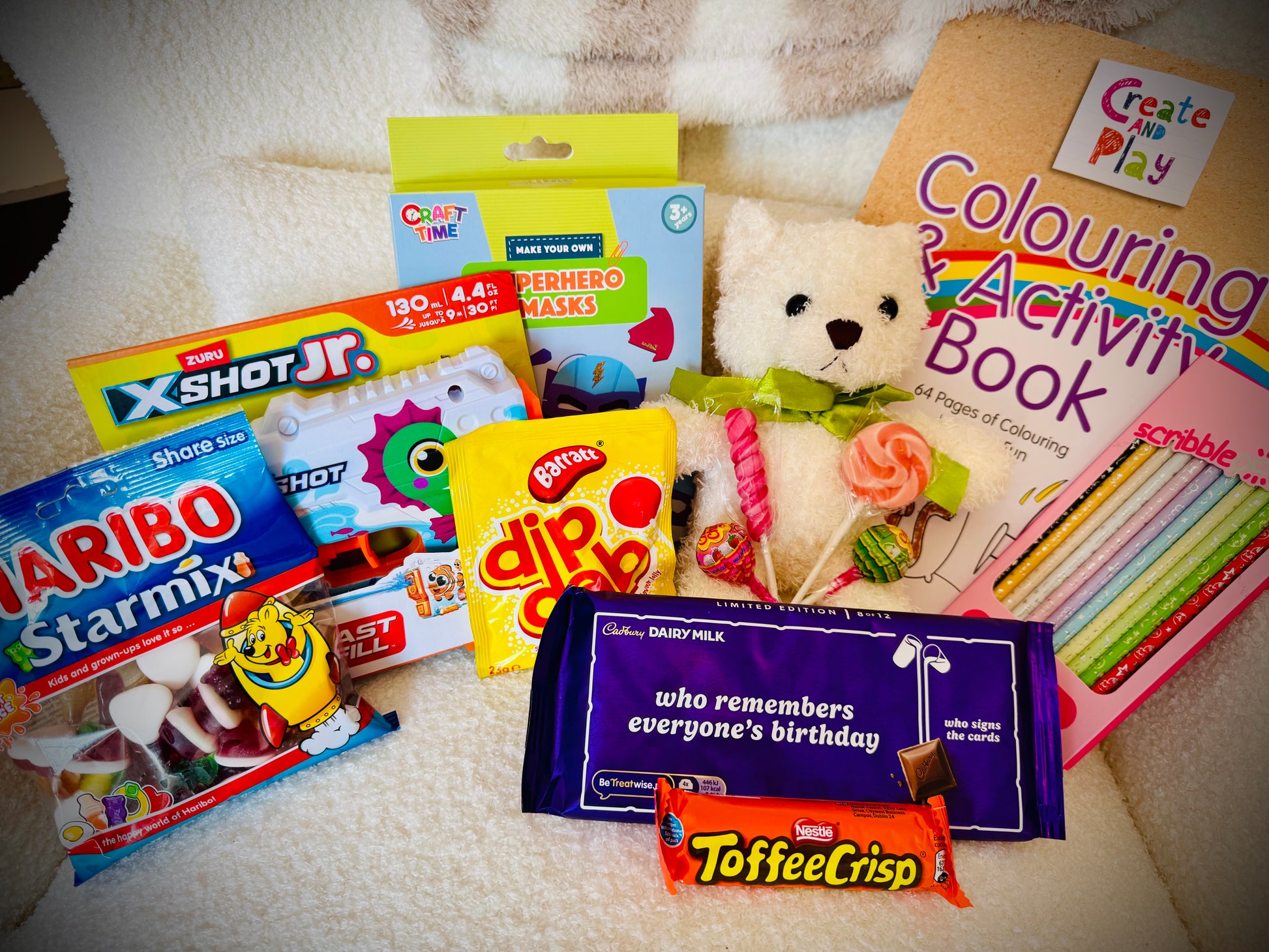 Mixed kids birthday gift box with toys art supplies and chocolates £30