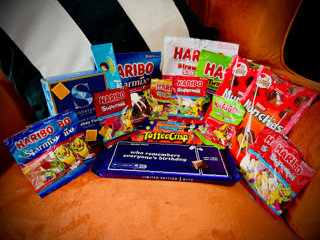 A selection of sweets and chocolates and fudges in a gift box with a handwritten card £20