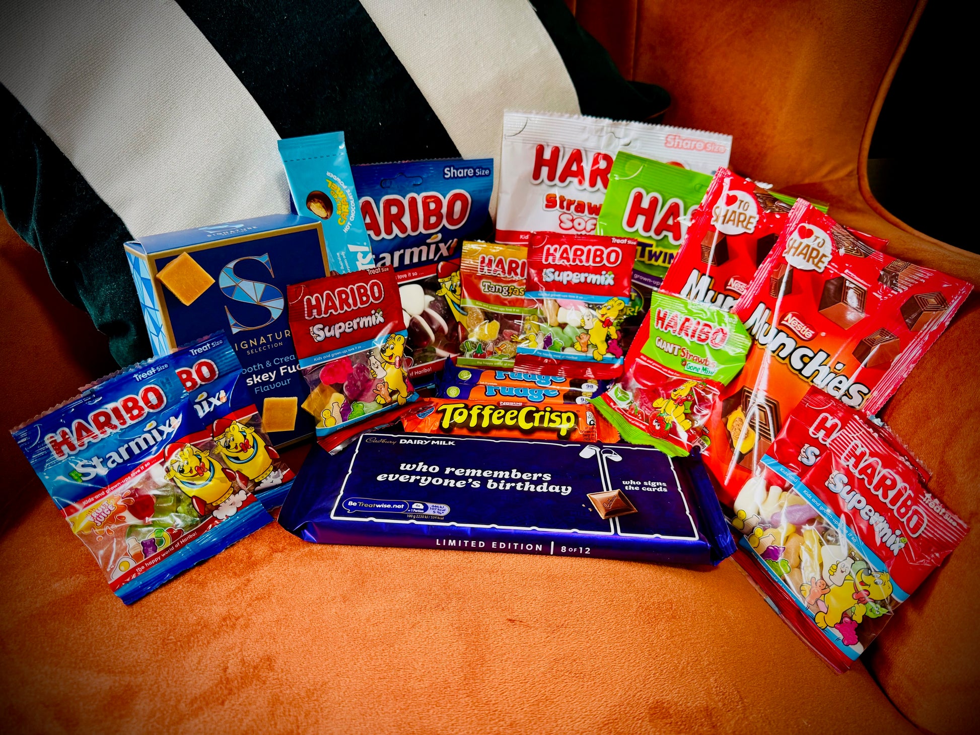 A selection of sweets and chocolates and fudges in a gift box with a handwritten card £20