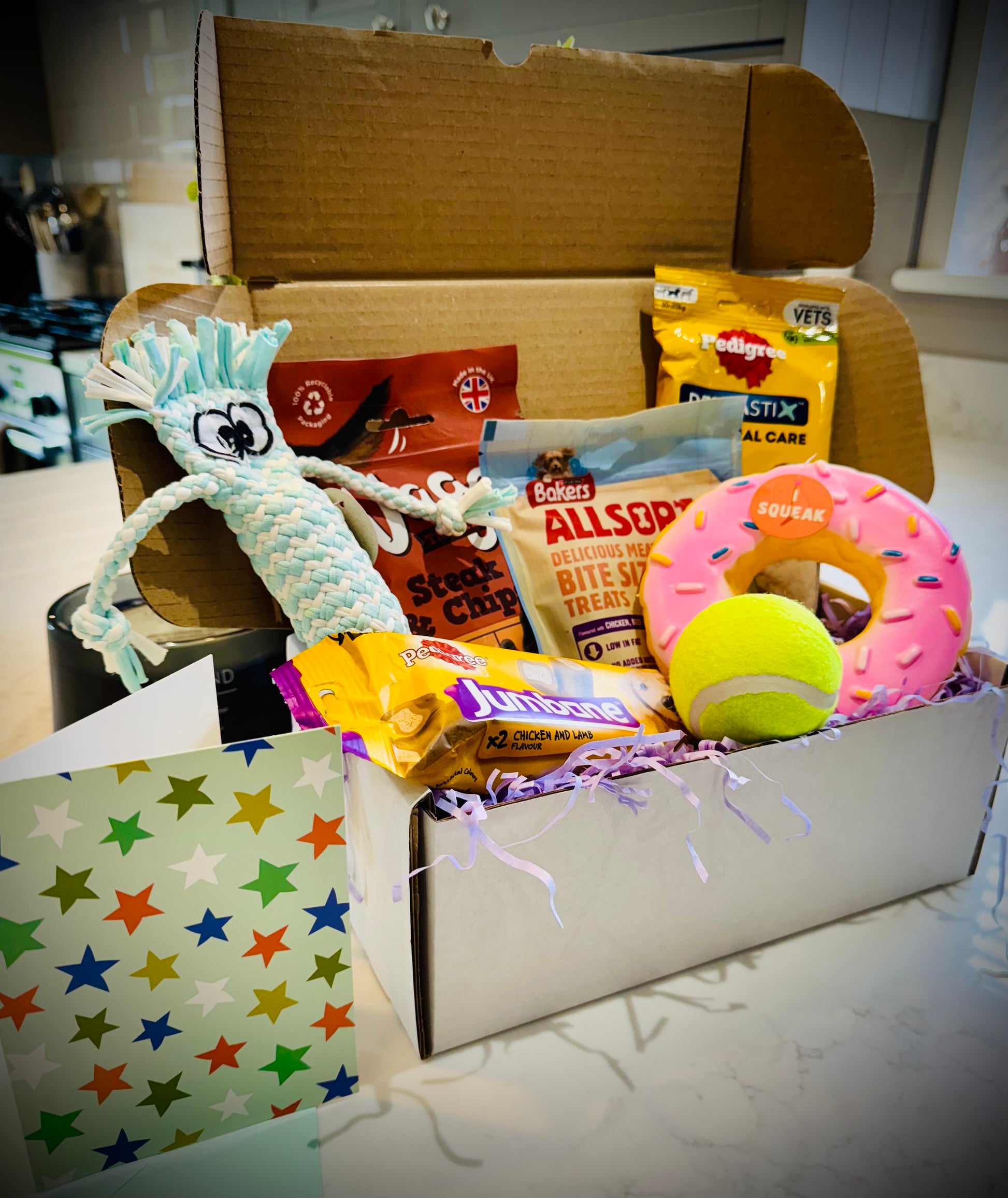 Assorted Dog products including toys and treats birthday gift box with a handwritten card £20