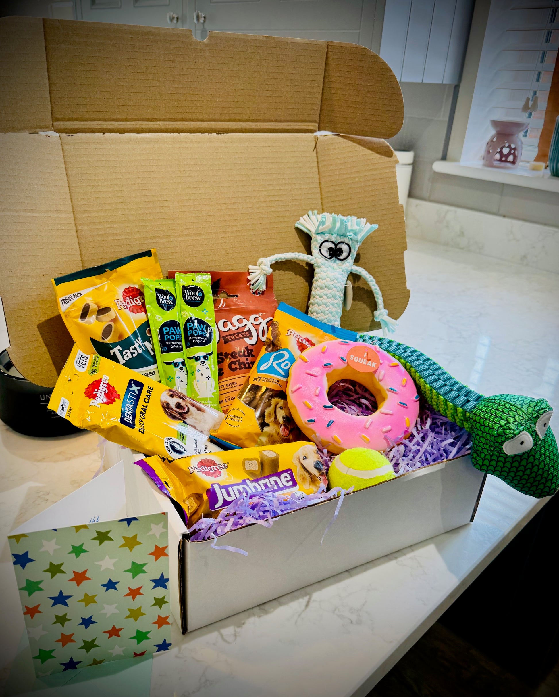 Assorted Dog products including toys and treats birthday gift box with a handwritten card £30