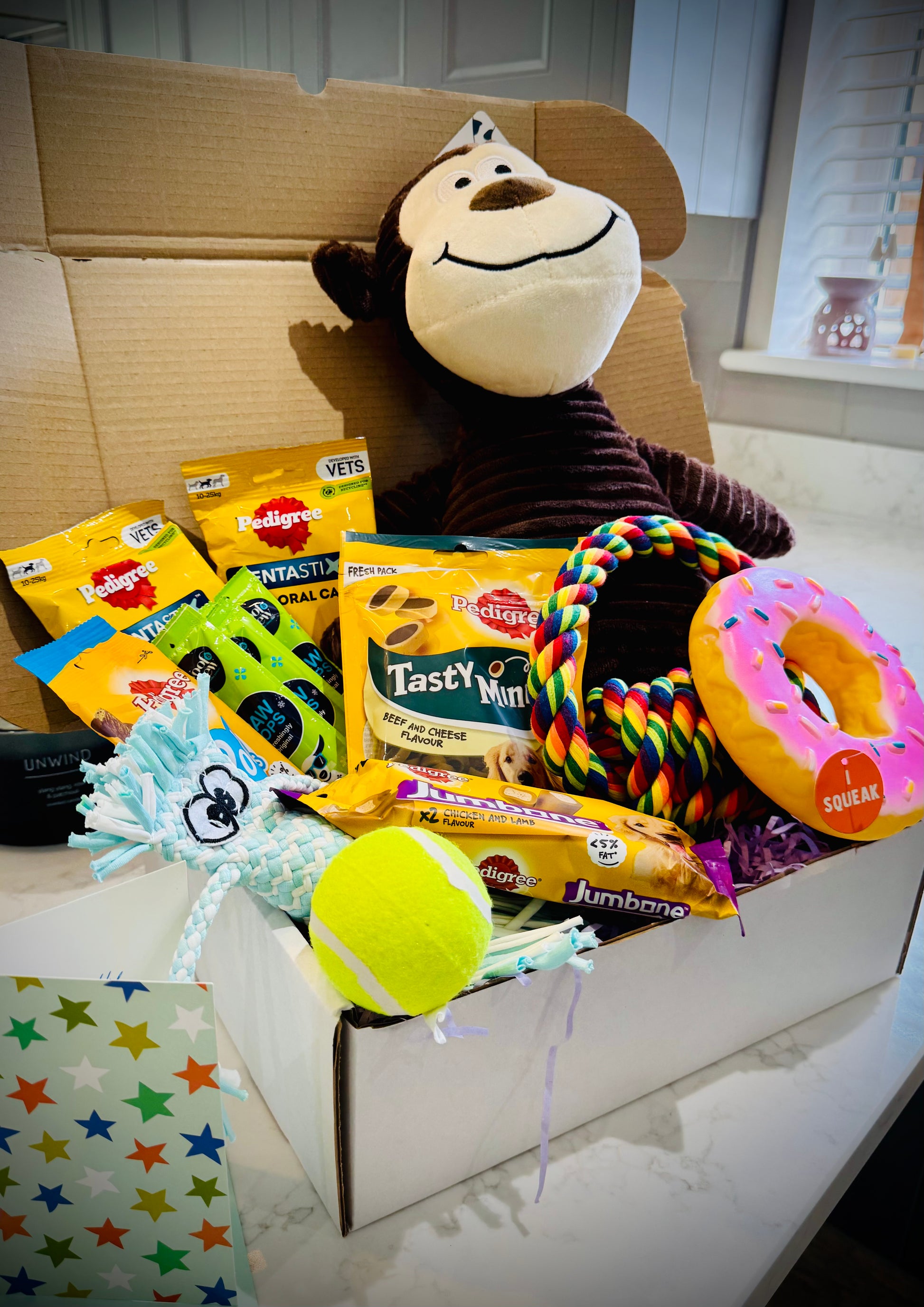 Assorted Dog products including toys and treats birthday gift box with a handwritten card £50