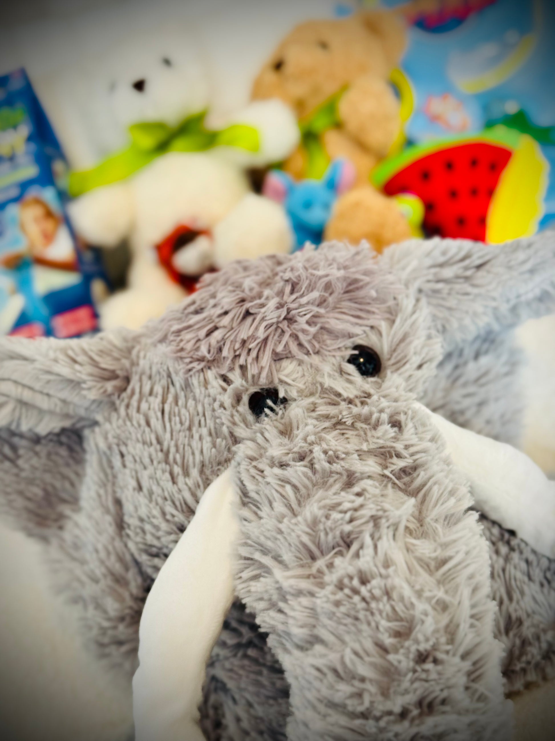 A selection of kids toys in a gift box with a handwritten card £50