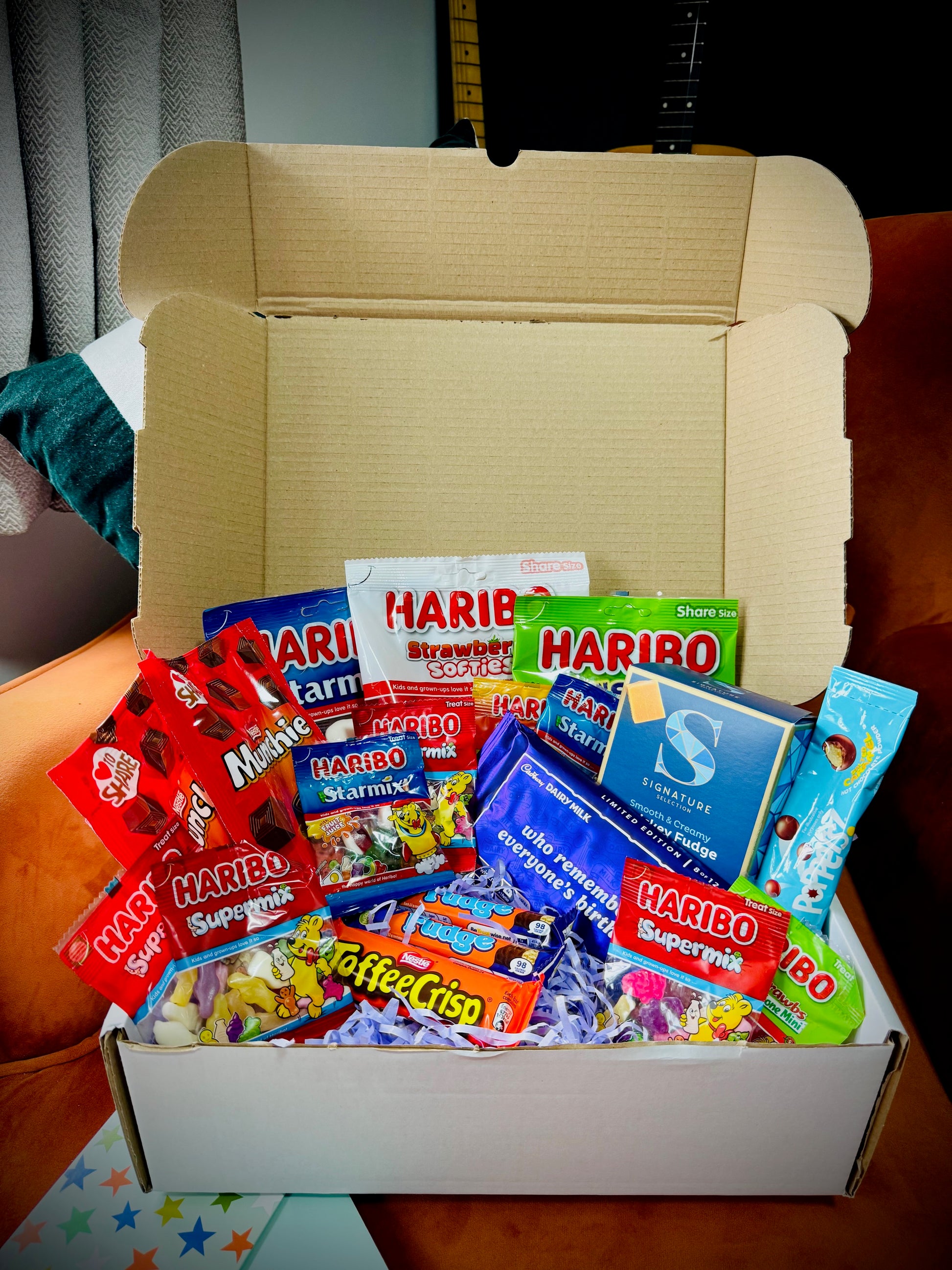 A selection of sweets and chocolates and fudges in a gift box with a handwritten card £20