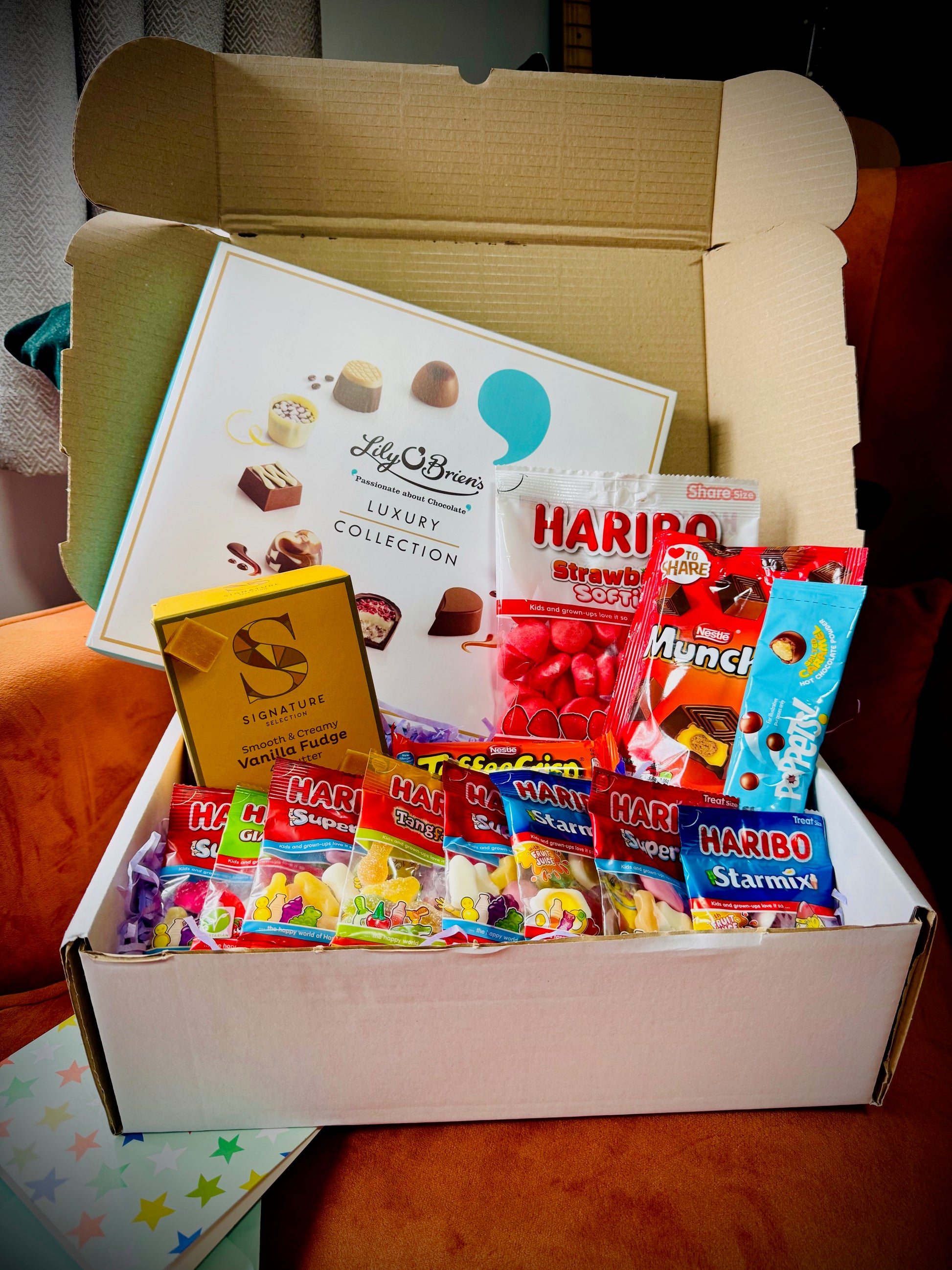 A selection of sweets and chocolates and fudges in a gift box with a handwritten card £30