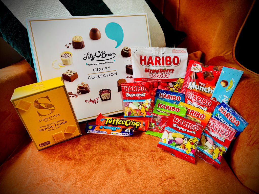 A selection of sweets and chocolates and fudges in a gift box with a handwritten card £30