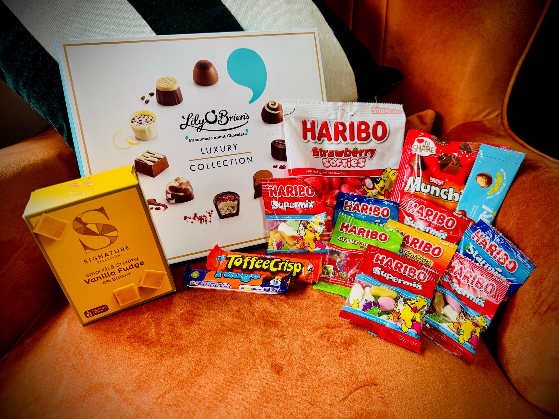 A selection of sweets and chocolates and fudges in a gift box with a handwritten card £30